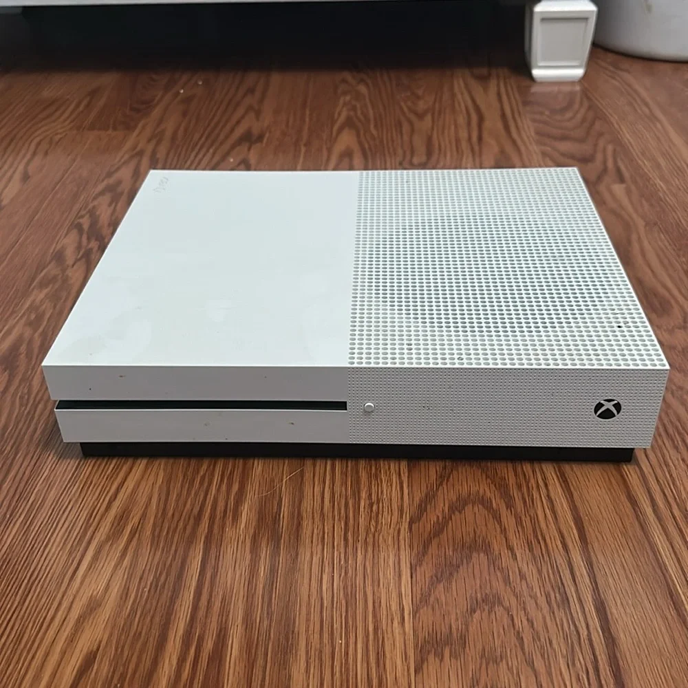 Microsoft xbox one console, controller, and hdmi cable.